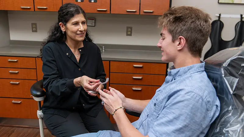 hygienist showing patient invisalign