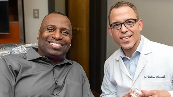 Client and doctor smiling