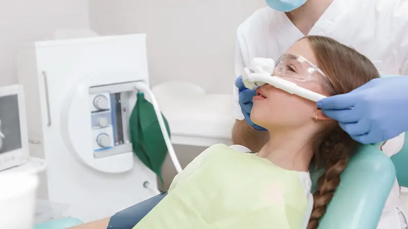 young girl receiving sedation dentistry