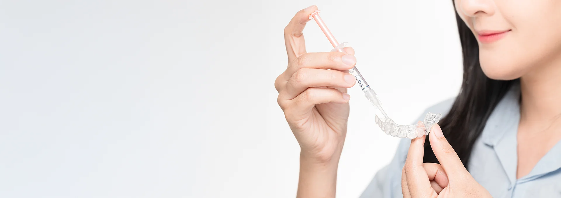 Photo of Person Putting Fluid in Invisalign